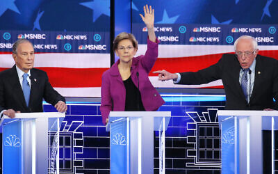 Democrat presidential candidate Mike Bloomberg, left, came under attack from Sen. Elizabeth Warren, Sen. Bernie Sanders and the other Democratic presidential candidates at the Nevada debate in Las Vegas, in Las Vegas, Nevada, February 19, 2020. (Mario Tama/Getty Images via JTA)