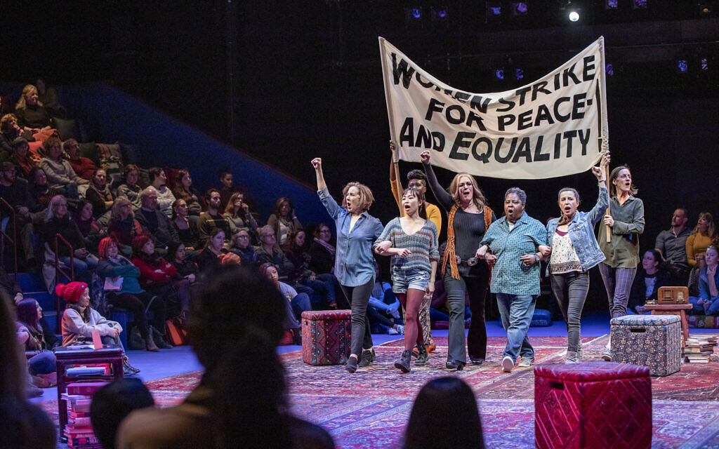 The cast of 'Gloria: A Life,' in a protest scene, by Emily Mann, directed by Diane Paulus, now at the American Repertory Theater in Cambridge, Massachusetts. (APrioriPhotography/ courtesy American Repertory Theater)