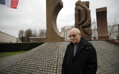Victor Perahia, who was interned as a child in the Drancy camp and deported to Bergen-Belsen, speaks to students during a workshop dedicated to the Holocaust remembrance at the Drancy Shoah memorial, outside Paris, January 30, 2020 (AP Photo/Christophe Ena)