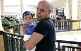Amer Fakhoury holds his granddaughter, Kira, in King of Prussia, Pennsylvania, June 2016. (Guila Fakhoury via AP, File)