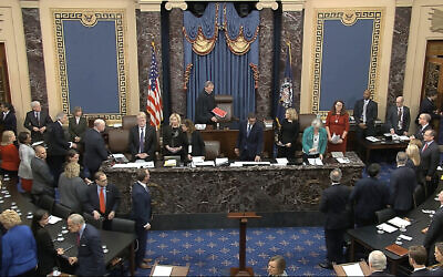 In this image from video, Chief Justice of the United States John Roberts arrives for the vote in the impeachment trial against President Donald Trump in the Senate at the US Capitol in Washington on February 5, 2020. (Senate Television via AP)