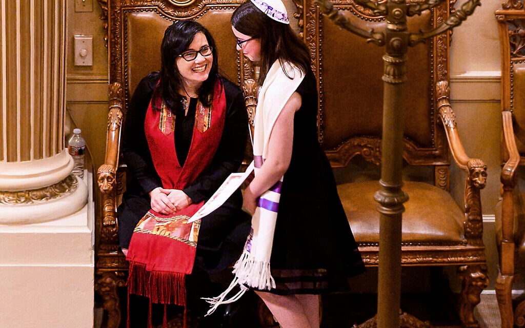 Illustrative: In this February 1, 2020, photo, Rabbi Jacqueline Mates-Muchin smiles at Hanna Raskin during her bat mitzvah at Temple Sinai in Oakland, California (AP/Noah Berger) Illustrative: In this February 1, 2020, photo, Rabbi Jacqueline Mates-Muchin smiles at Hanna Raskin during her bat mitzvah at Temple Sinai in Oakland, California (AP/Noah Berger)