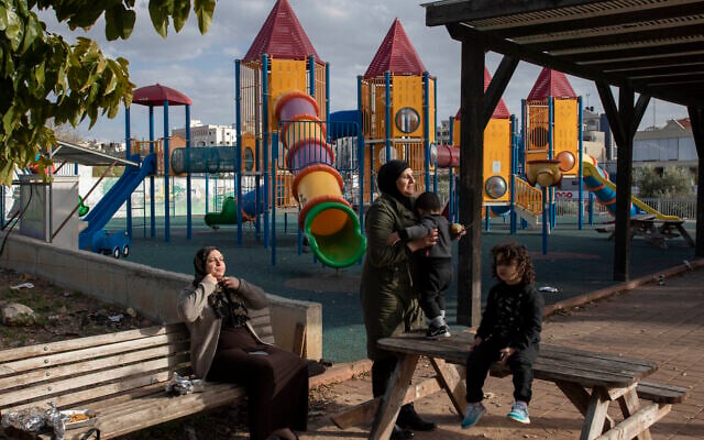 In this Thursday, Feb. 6, 2020, photo, Israeli Arabs enjoy the day at a playground in the Israeli Arab town Kafr Qasim (AP Photo/Oded Balilty) In this Thursday, Feb. 6, 2020, photo, Israeli Arabs enjoy the day at a playground in the Israeli Arab town Kafr Qasim (AP Photo/Oded Balilty)