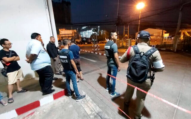 Police and bystanders stand near the scene of a shooting at the Terminal 21 mall, in Korat, Thailand, Saturday, Feb. 8, 2020. (AP Photo) Police and bystanders stand near the scene of a shooting at the Terminal 21 mall, in Korat, Thailand, Saturday, Feb. 8, 2020. (AP Photo)