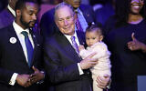 Democratic presidential candidate and former New York City Mayor Michael Bloomberg is joined on stage by supporters during his campaign launch of "Mike for Black America," at the Buffalo Soldiers National Museum, Thursday, Feb. 13, 2020, in Houston. (AP Photo/David J. Phillip)