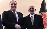 US Secretary of State Mike Pompeo, left, shakes hands with Afghan President Ashraf Ghani,during the 56th Munich Security Conference (MSC) in Munich, southern Germany, on Friday, Feb. 14, 2020.  (Andrew Caballero-Reynolds/Pool photo via AP)