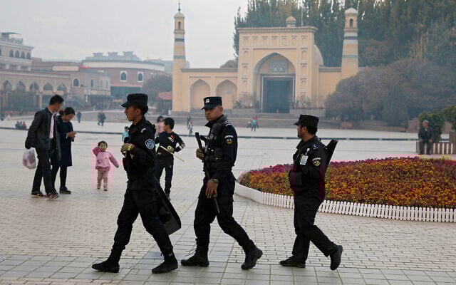 Uighur security personnel patrol near the Id Kah Mosque in Kashgar in western China's Xinjiang region, on November 4, 2017. (AP/Ng Han Guan, File) Uighur security personnel patrol near the Id Kah Mosque in Kashgar in western China's Xinjiang region, on November 4, 2017. (AP/Ng Han Guan, File)