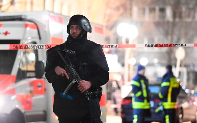 A police officer stands guard near the scene in front of a restaurant after a shooting in central Hanau, Germany, February 20, 2020. Eight people were killed in shootings in the German city of Hanau the previous evening, authorities said. (Boris Roessler/dpa via AP) A police officer stands guard near the scene in front of a restaurant after a shooting in central Hanau, Germany, February 20, 2020. Eight people were killed in shootings in the German city of Hanau the previous evening, authorities said. (Boris Roessler/dpa via AP)