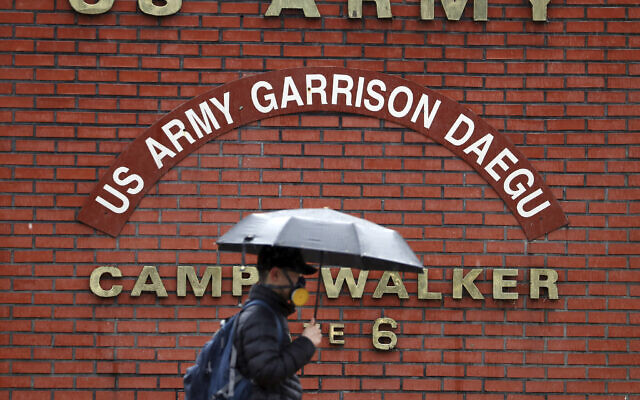 In this Tuesday, Feb. 25, 2020, photo, a man passes by U.S. Army base Camp Walker, in Daegu, South Korea. (Kim Hyun-tae/Yonhap via AP) In this Tuesday, Feb. 25, 2020, photo, a man passes by U.S. Army base Camp Walker, in Daegu, South Korea. (Kim Hyun-tae/Yonhap via AP)