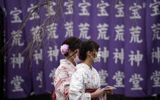 Visitors wear protective masks Wednesday, Feb. 26, 2020, in Tokyo, Japan. (AP Photo/Eugene Hoshiko) Visitors wear protective masks Wednesday, Feb. 26, 2020, in Tokyo, Japan. (AP Photo/Eugene Hoshiko)