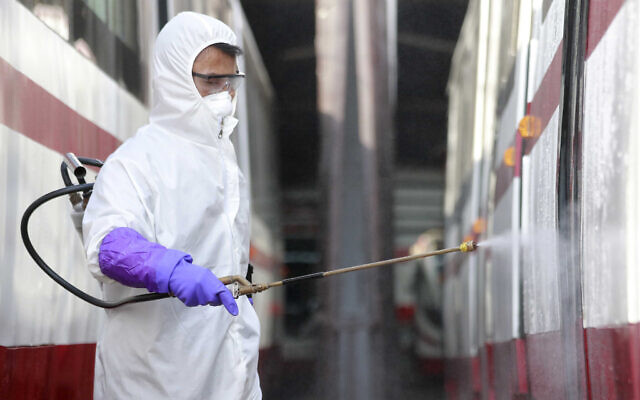 A member of an emergency anti-epidemic headquarters in Mangyongdae District disinfects a tramcar at Songsan Tram Station to prevent new coronavirus infection in Pyongyang, North Korea, Wednesday, Feb. 26, 2020. (AP Photo/Cha Song Ho) A member of an emergency anti-epidemic headquarters in Mangyongdae District disinfects a tramcar at Songsan Tram Station to prevent new coronavirus infection in Pyongyang, North Korea, Wednesday, Feb. 26, 2020. (AP Photo/Cha Song Ho)