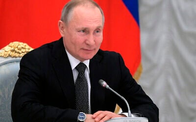 Russian President Vladimir Putin speaks during a meeting with members of a working group created to discuss constitutional amendments in Moscow, Russia, February 26, 2020. (Alexei Druzhinin, Sputnik, Kremlin Pool Photo via AP)