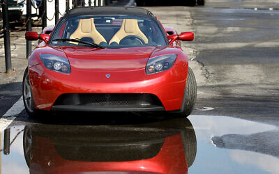 The Tesla Roadster electric car sits parked on a street in New York, Thursday, Feb. 19, 2009 (AP Photo/Craig Ruttle)