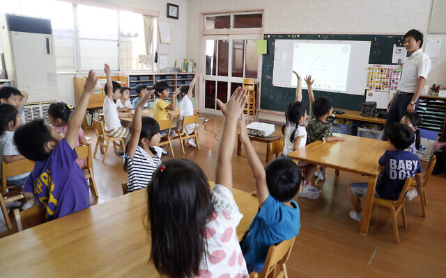 Illustrative -- Japanese schoolchildren at a Coby Preschool in Yoshikawa, suburban Tokyo, July 12, 2018. (AP Photo/Yuri Kageyama) Illustrative -- Japanese schoolchildren at a Coby Preschool in Yoshikawa, suburban Tokyo, July 12, 2018. (AP Photo/Yuri Kageyama)