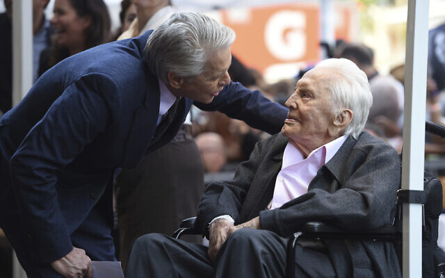 Honoree Michael Douglas, left, speaks with his father Kirk Douglas before a Hollywood Walk of Fame star ceremony on Nov. 6, 2018, in Los Angeles. (Chris Pizzello/Invision/AP) Honoree Michael Douglas, left, speaks with his father Kirk Douglas before a Hollywood Walk of Fame star ceremony on Nov. 6, 2018, in Los Angeles. (Chris Pizzello/Invision/AP)