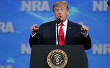 US President Donald Trump speaks at the National Rifle Association Institute for Legislative Action Leadership Forum in Lucas Oil Stadium in Indianapolis, Friday, April 26, 2019. (AP Photo/Michael Conroy)