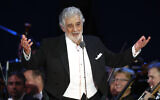 In this August 28, 2019 file photo, opera star Placido Domingo salutes spectators at the end of a concert in Szeged, Hungary (AP Photo/Laszlo Balogh)