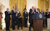 Illustrative: US President Donald Trump with, first lady Melania Trump, Vice President Mike Pence, from left, Jared Kushner and Ivanka Trump and their children Arabella Kushner and Joseph Kushner, applaud during a Hanukkah reception in the East Room of the White House on December 11, 2019, in Washington. (AP/Manuel Balce Ceneta)
