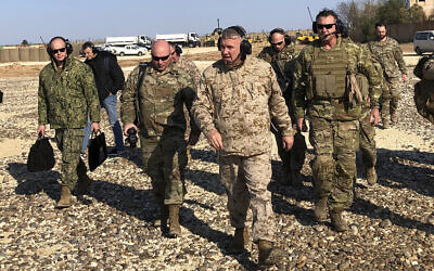 Gen. Frank McKenzie, center front, the top US commander for the Middle East, walks as he visits a military outpost in Syria, on January 25, 2020. (AP Photo/Lolita Baldor)