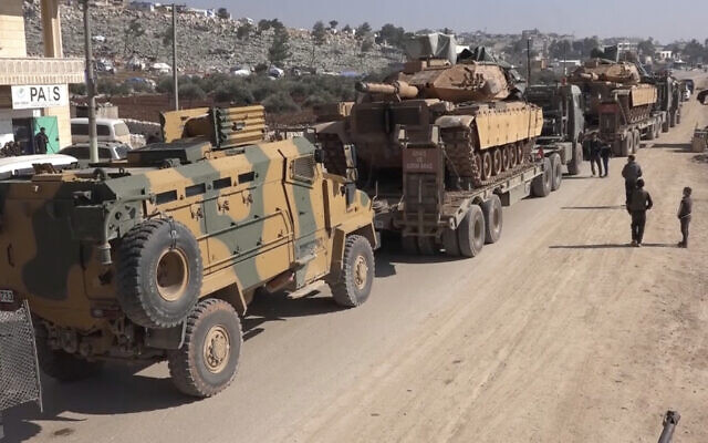 Screen capture from video of a Turkey Armed Forces convoy is seen at the northern town of Sarmada, in Idlib province, Syria, February 2, 2020. (APTN/AP) Screen capture from video of a Turkey Armed Forces convoy is seen at the northern town of Sarmada, in Idlib province, Syria, February 2, 2020. (APTN/AP)