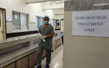 A Pakistan doctor enters an isolation ward set up as a preventative measure following the deadly Coronavirus outbreak, at the Jinnah Postgraduate Medical Center in Karachi, Pakistan, February 3, 2020. (Fareed Khan/AP)