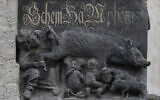A sculpture depicting the so-called Judensau, or Jews' pig, adorns the facade of the Stadtkirche (Town Church) in Wittenberg, Germany, January 14, 2020. (AP Photo/Jens Meyer, File )