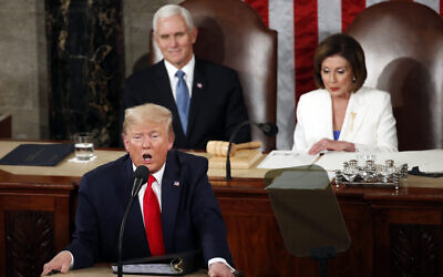 President Donald Trump delivers his State of the Union address to a joint session of Congress on Capitol Hill in Washington, on February 4, 2020, as Vice President Mike Pence listens and House Speaker Nancy Pelosi of California reads. (AP Photo/Alex Brandon)