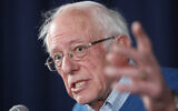 Democratic presidential candidate Sen. Bernie Sanders, I-Vt., gestures while speaking during a news conference at his New Hampshire headquarters, Thursday, Feb. 6, 2020 in Manchester, N.H. (AP Photo/Pablo Martinez Monsivais)