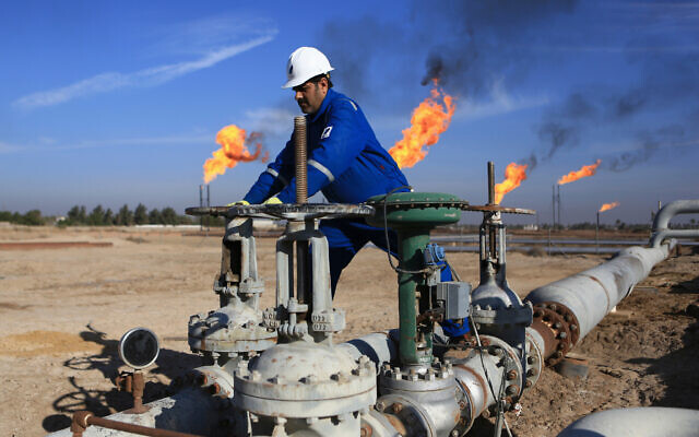 In this Jan. 12, 2017 file photo, a worker operates valves in Nihran Bin Omar field north of Basra, Iraq (AP Photo/Nabil al-Jurani, File) In this Jan. 12, 2017 file photo, a worker operates valves in Nihran Bin Omar field north of Basra, Iraq (AP Photo/Nabil al-Jurani, File)
