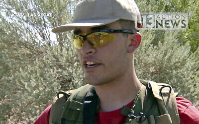This Sept. 22, 2016, file photo taken from video from KTNV 13 Action News shows Conor Climo during an interview while walking a Las Vegas neighborhood, heavily armed (KTNV 13 Action News via AP, File)