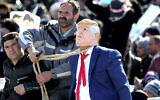 A protester pulls a rope around the neck of a man impersonating US President Donald Trump during a rally at Azadi (Freedom) Square in celebration of the 41st anniversary of the Islamic Revolution, in Tehran, Iran, February 11, 2020. (AP Photo/Ebrahim Noroozi)