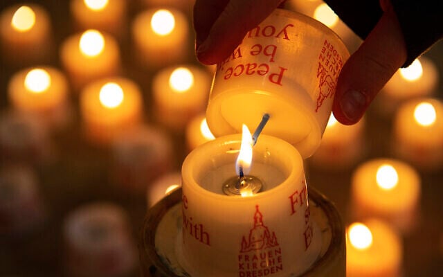 A child lights a candle in the Frauenkirche cathedral (Church of Our Lady) in Dresden, Germany, February 11, 2020. (Jens Meyer/AP) A child lights a candle in the Frauenkirche cathedral (Church of Our Lady) in Dresden, Germany, February 11, 2020. (Jens Meyer/AP)