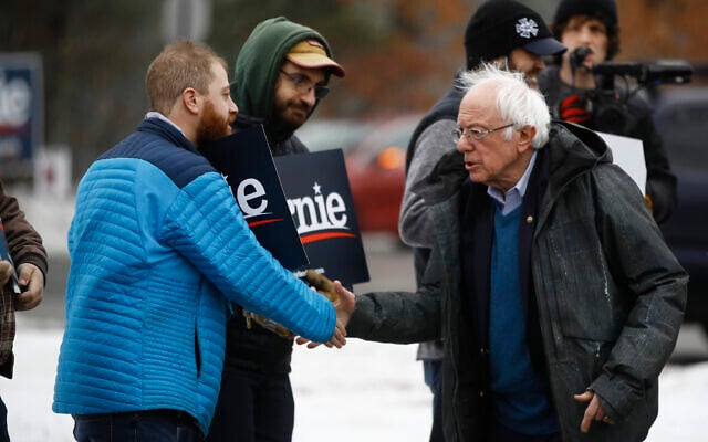 Democratic presidential candidate Sen. Bernie Sanders, I-Vt., meets with people outside a polling place where voters will cast their ballots in a primary election, in Manchester, N.H., Tuesday, Feb. 11, 2020. (AP/Matt Rourke) Democratic presidential candidate Sen. Bernie Sanders, I-Vt., meets with people outside a polling place where voters will cast their ballots in a primary election, in Manchester, N.H., Tuesday, Feb. 11, 2020. (AP/Matt Rourke)