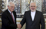 Iranian Foreign Minister Mohammad Javad Zarif, right, and European Union foreign policy chief Josep Borrell shake hands prior to their meeting in Tehran, Iran, February 3, 2020. (AP Photo/Ebrahim Noroozi, File)