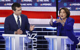 Democratic presidential candidates, Sen. Amy Klobuchar, Democat-Minnesota, right, speaks as former South Bend Mayor Pete Buttigieg looks on during a Democratic presidential primary debate hosted by NBC News and MSNBC in Las Vegas, February 19, 2020. (John Locher/AP)