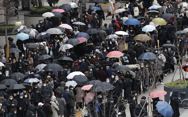 People line up to buy face masks to protect themselves from the new coronavirus outside a department store in Seoul, South Korea, Feb. 28, 2020. (AP Photo/Lee Jin-man) People line up to buy face masks to protect themselves from the new coronavirus outside a department store in Seoul, South Korea, Feb. 28, 2020. (AP Photo/Lee Jin-man)