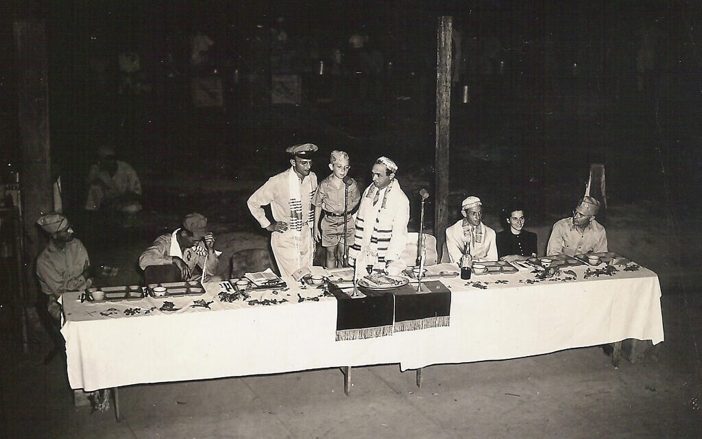 Ten-year-old Jewish refugee George Lowenstein (standing at mic), who arrived in the Philippines as a toddler, attends a bar mitzvah celebration in 1945 in his new country. (Courtesy of George Lowenstein)
