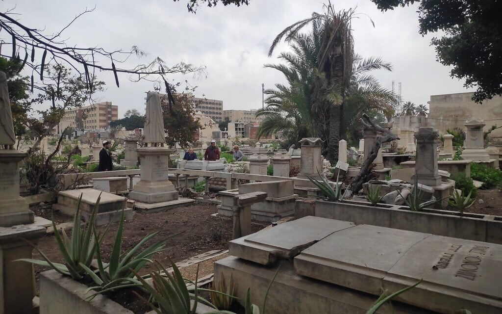 Members of the Egyptian Jewish Diaspora visit their grandfather's grave at the Chatby cemetery in Alexandria. (David Lisbona)