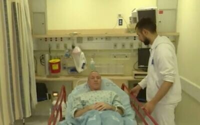 Screen capture from video of Blue and White MK Chili Tropper in hospital to donate a kidney, February 2, 2020. (Channel 12)