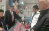 Jerusalem Mayor Moshe Lion (2L) visiting the hospital bed of Malik Eissa, 9, who was shot by a police officer in Issawiya, February 22, 2020. (Screenshot: Twitter)