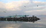 View of the Sea of Galilee as it seen from the beach promenade in the northern Israeli city of Tiberias, on January 30, 2020. (David Cohen/Flash90)