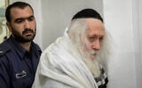 Rabbi Eliezer Berland arrives for a hearing at the Jerusalem Magistrate's Court, on February 13, 2020. (Yonatan Sindel/Flash90)