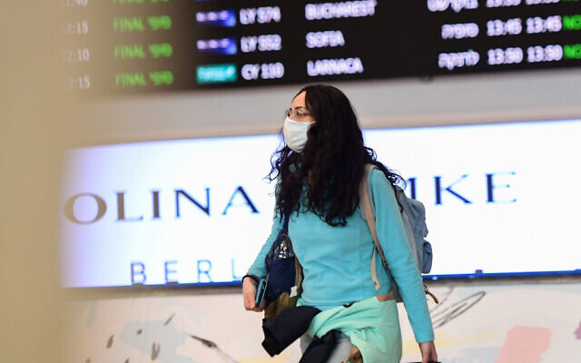 People wear face masks at the Ben Gurion International Airport following reports about the deadly coronavirus, originated in China, having spread worldwide. February 17, 2020. (Avshalom Shoshani/Flash90) People wear face masks at the Ben Gurion International Airport following reports about the deadly coronavirus, originated in China, having spread worldwide. February 17, 2020. (Avshalom Shoshani/Flash90)