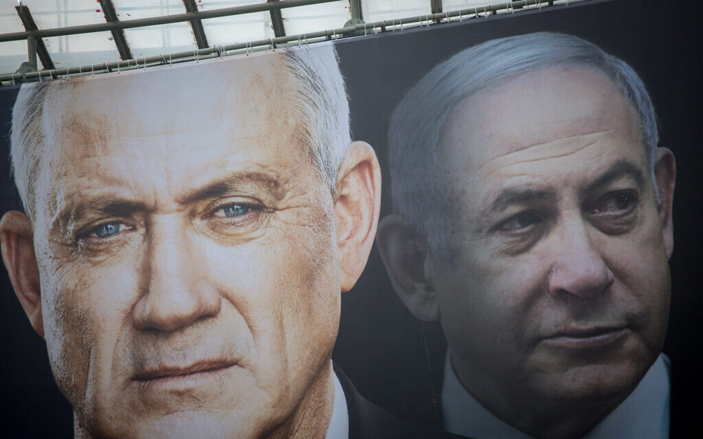 Election posters put up by Blue and White show candidates Benny Gantz (left) and Benjamin Netanyahu on February 18, 2020. (Miriam Alster/Flash90) Election posters put up by Blue and White show candidates Benny Gantz (left) and Benjamin Netanyahu on February 18, 2020. (Miriam Alster/Flash90)