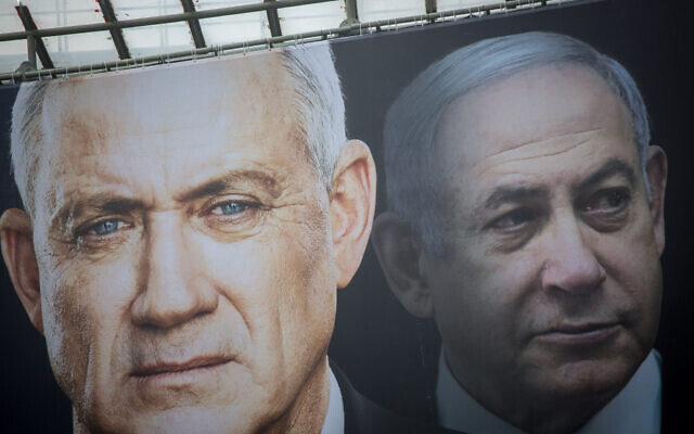 Election posters put up by Blue and White show candidates Benny Gantz (left) and Benjamin Netanyahu on February 18, 2020. (Miriam Alster/Flash90) Election posters put up by Blue and White show candidates Benny Gantz (left) and Benjamin Netanyahu on February 18, 2020. (Miriam Alster/Flash90)