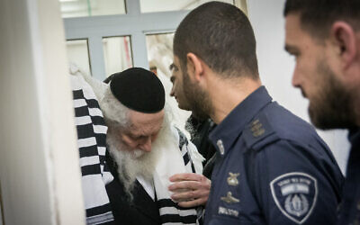 Rabbi Eliezer Berland arrives for a court hearing at the Magistrate's Court in Jerusalem, on February 20, 2020. (Yonatan Sindel/Flash90 )