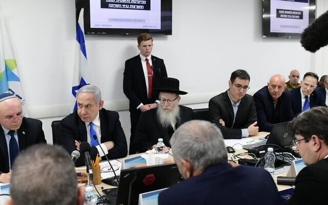 Illustrative: Prime Minister Benjamin Netanyahu (2nd-L) and Health Minister Yaakov Litzman (3rd-L) attend a situational assement on the coronavirus at the Health Ministry in Tel Aviv on February 23, 2020. (Tomer Neuberg/ Flash90) Illustrative: Prime Minister Benjamin Netanyahu (2nd-L) and Health Minister Yaakov Litzman (3rd-L) attend a situational assement on the coronavirus at the Health Ministry in Tel Aviv on February 23, 2020. (Tomer Neuberg/ Flash90)