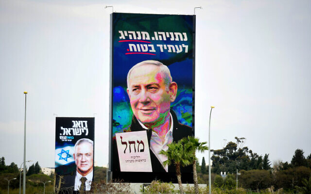 View of an election campaign billboards showing Israeli prime minister and head of the Likud party Benjamin Netanyahu and Blue and White chairman Benny Gantz, in Tel Aviv on February 24, 2020. (Flash90) View of an election campaign billboards showing Israeli prime minister and head of the Likud party Benjamin Netanyahu and Blue and White chairman Benny Gantz, in Tel Aviv on February 24, 2020. (Flash90)