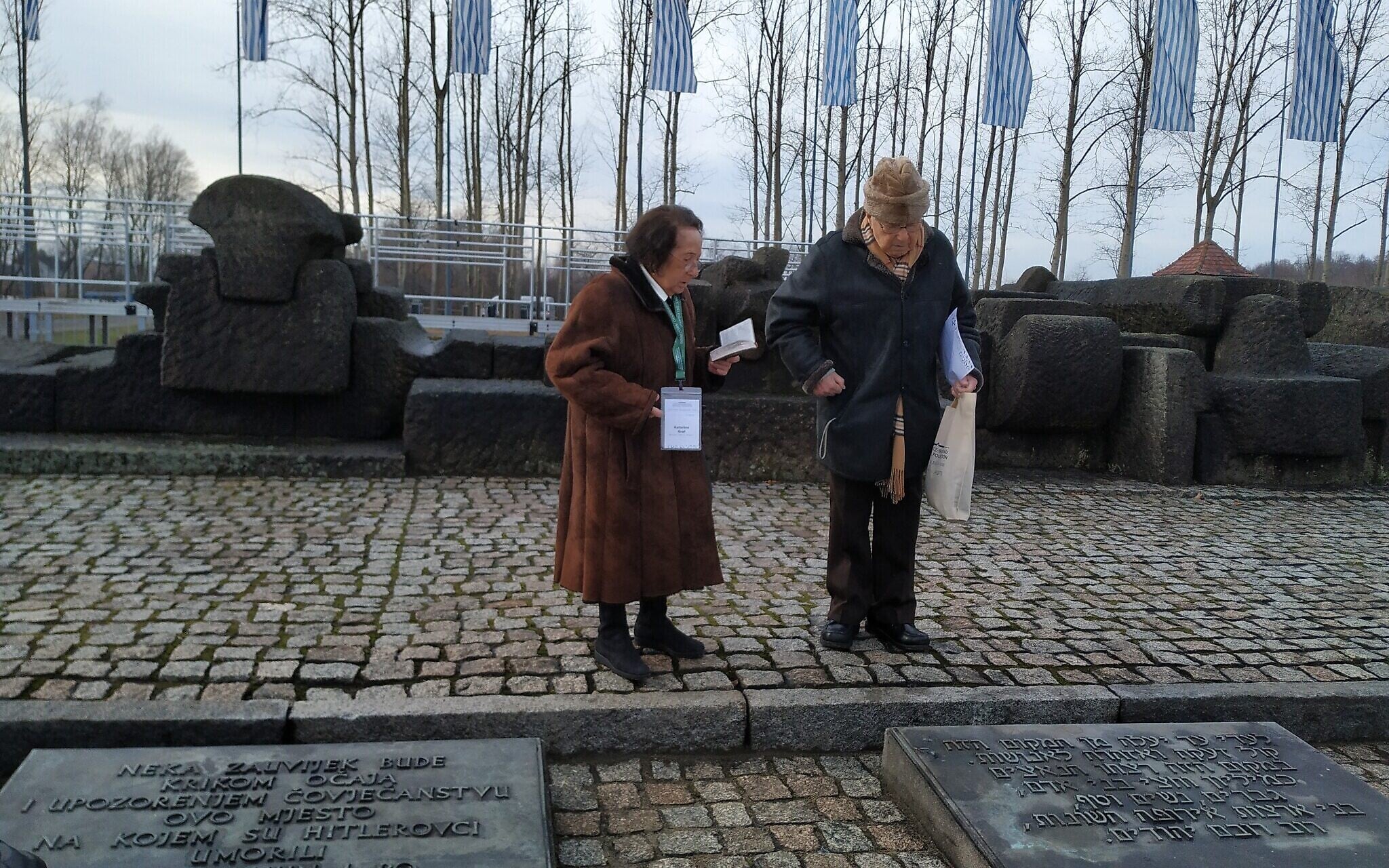 Sol and Katarina Graf near the memorial between the gas chambers and crematoria at the former Auschwitz II-Birkenau, January 28, 2020. (Yaakov Schwartz/ Times of Israel) Sol and Katarina Graf near the memorial between the gas chambers and crematoria at the former Auschwitz II-Birkenau, January 28, 2020. (Yaakov Schwartz/ Times of Israel)