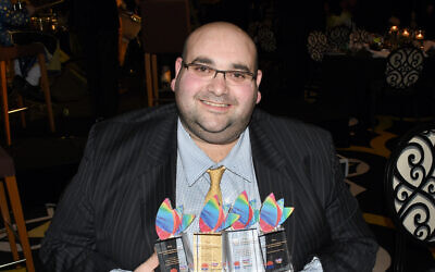 Australian Jewish News CEO Joshua Levi with his New South Wales Premier’s Multicultural Media Awards. (Noel Kessel/courtesy)